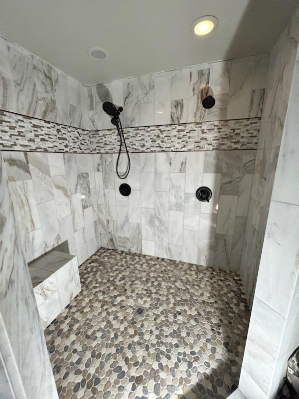 Walk-in shower with floor-to-ceiling tile and frameless glass in Tulsa, OK