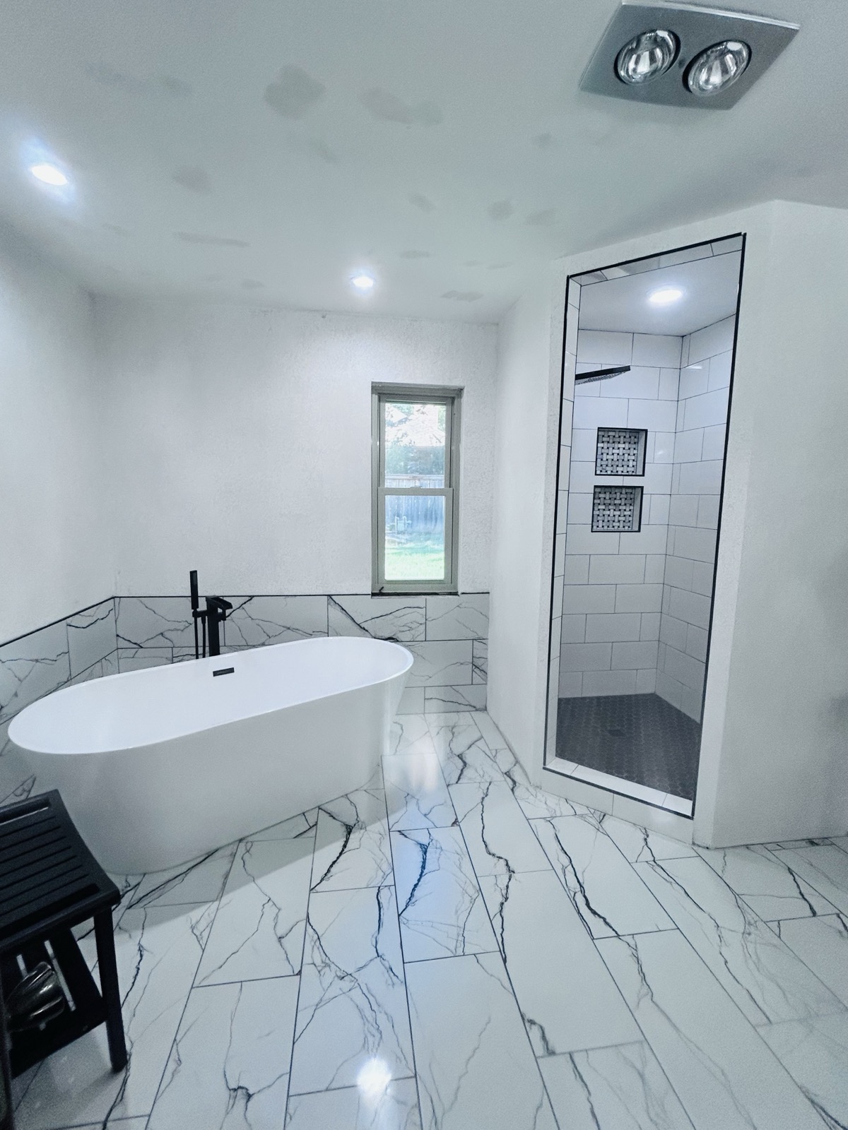 Guest bathroom detail showing tile work and fixtures in Broken Arrow, OK