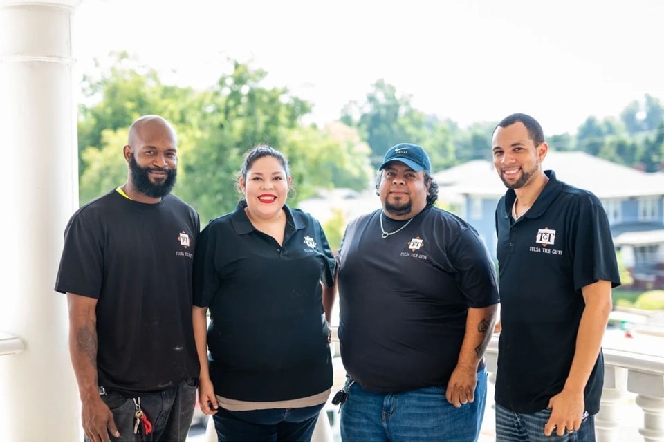 The Tulsa Remodel Guys crew of four outside a Tulsa home