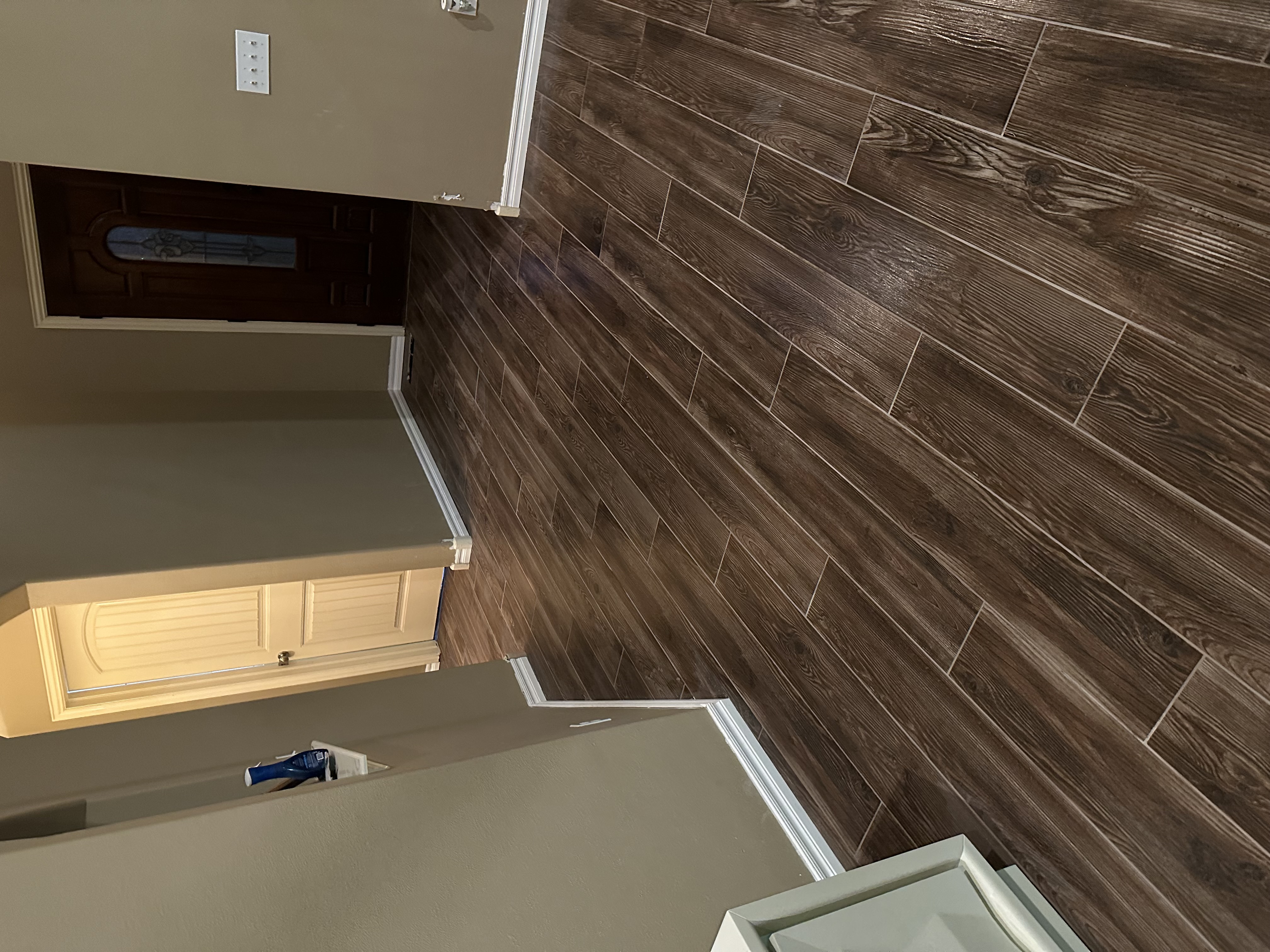 Large-format porcelain floor tile installation in Tulsa home